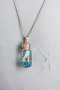 Collier pendentif bouteille à la mer chaîne acier inoxydable argenté artisanal unique – Les Éclats de Mel"